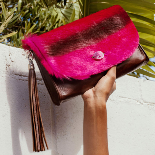 The Malaika Springbok Clutch Bag In Fuchsia