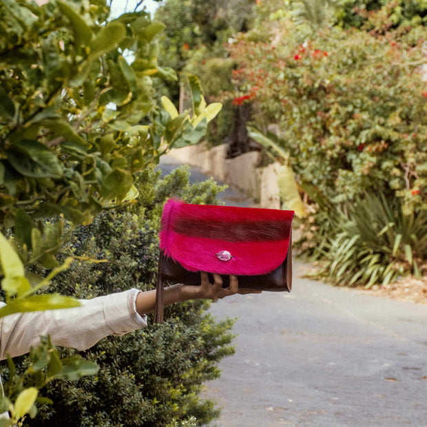 The Malaika Springbok Clutch Bag In Fuchsia