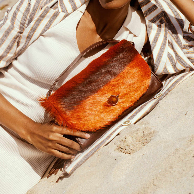 The Malaika Springbok Clutch Bag In Sunset